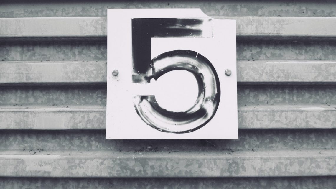 gray tile with white number five printed text